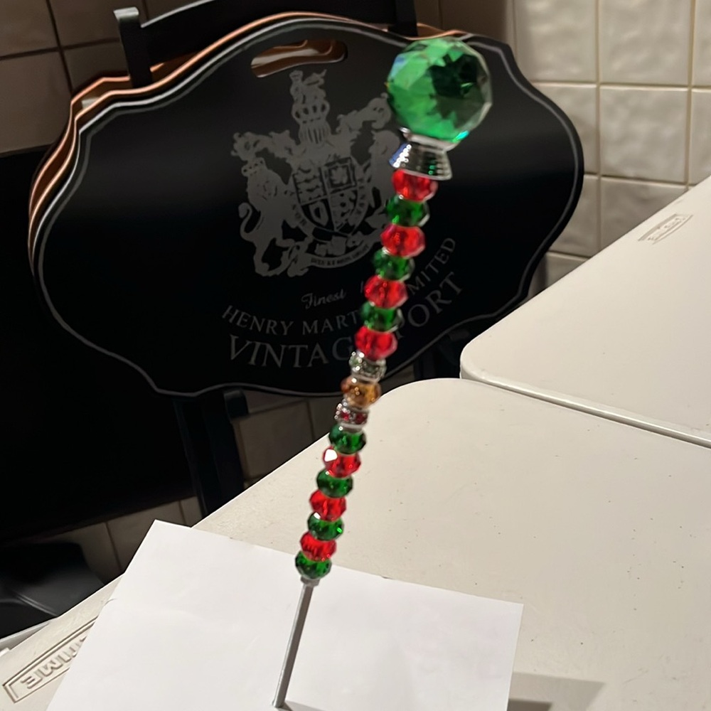 Green and Red Beaded plant stick-decor
